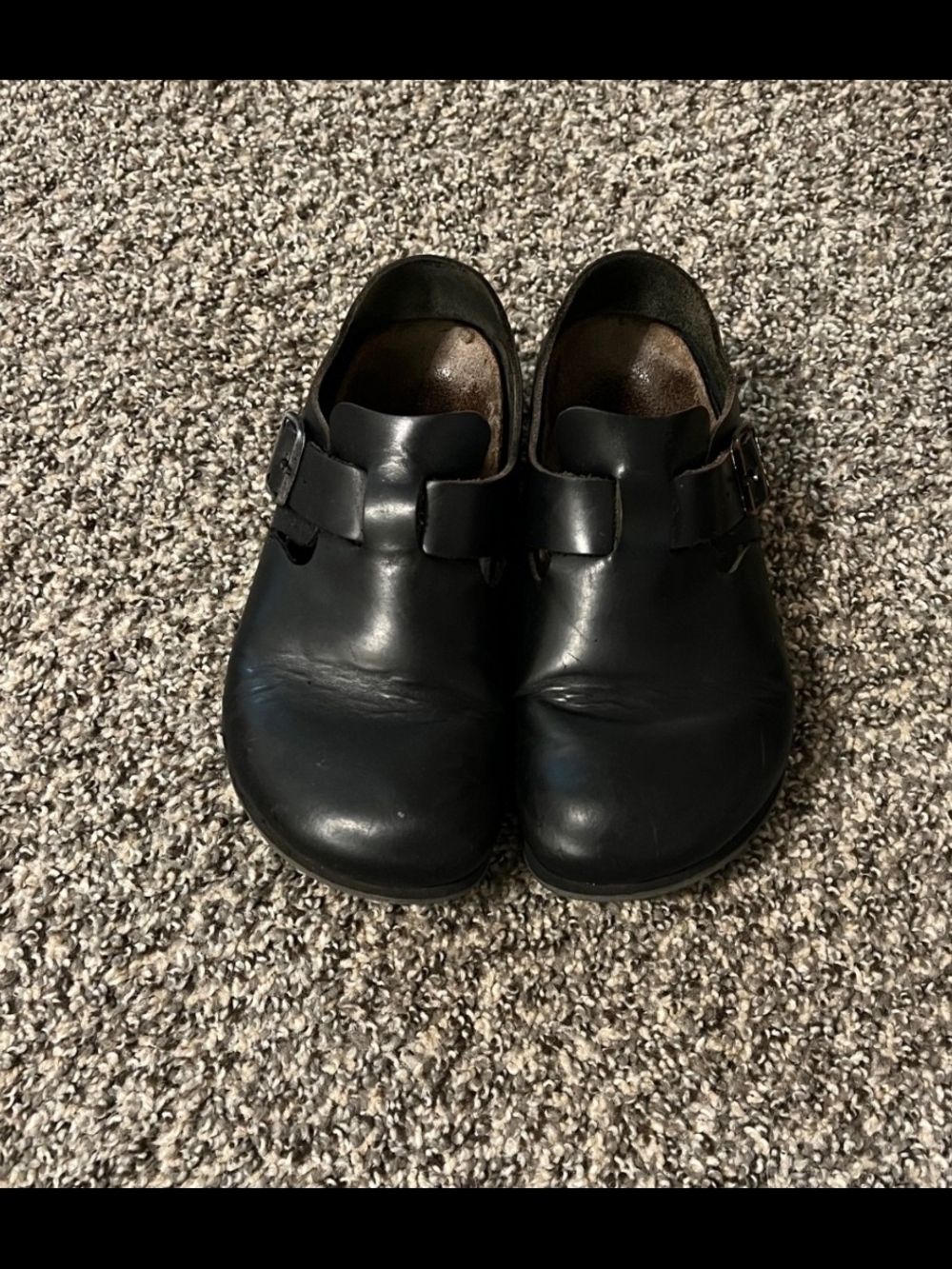 Birkenstock London  Black Leather Slip-On Clogs with Buckle Accent
